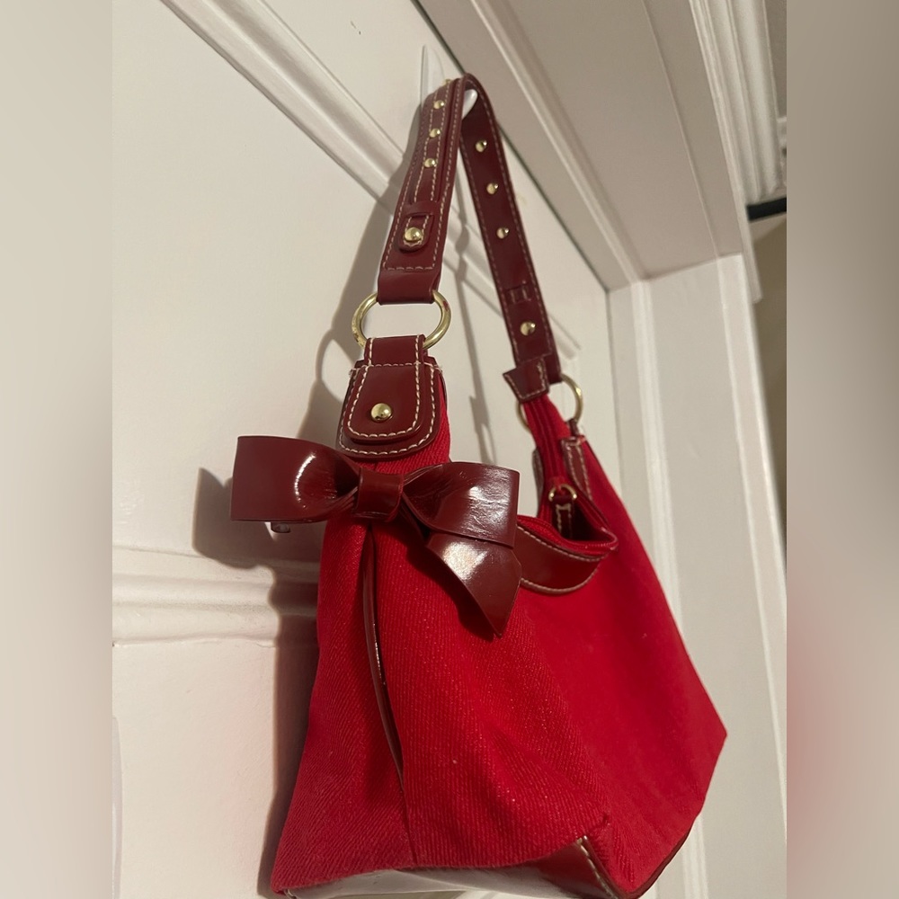 Red Women’s Handbag with bow and gold detail.